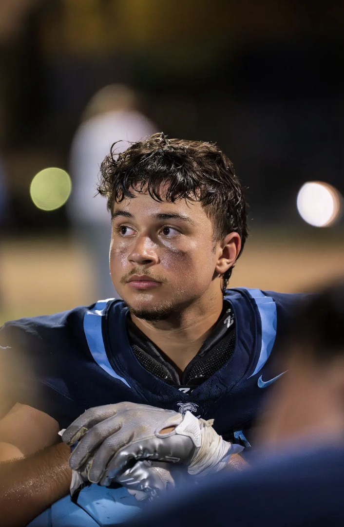 Clemens looking off into the distance at a football game.