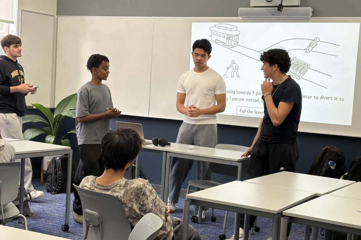 Model UN Co-Secretary-General Derrick Lee ’26 leads a mock MUN meeting for eighth graders during Preview Week.
