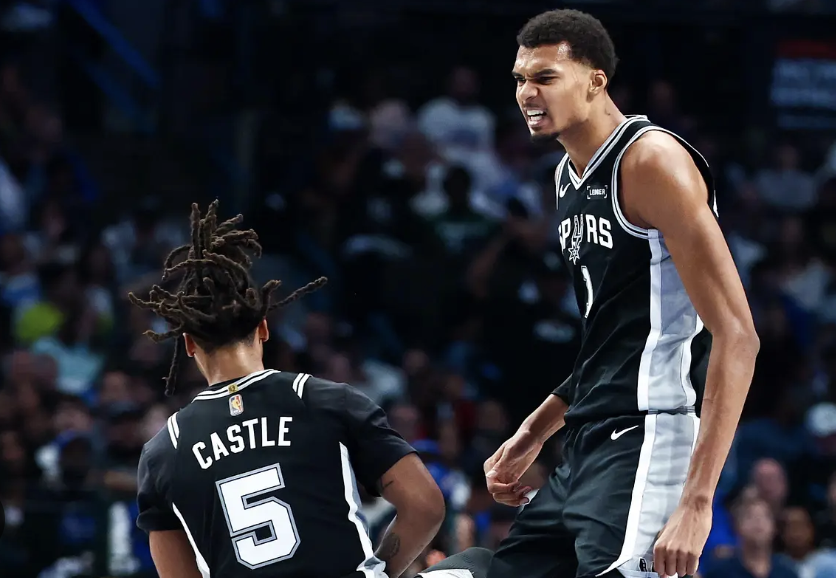 San Antonio Spurs forward Victor Wembanyama celebrates with guard Stephon Castle during the first half
against the Dallas Mavericks at American Airlines Center.
